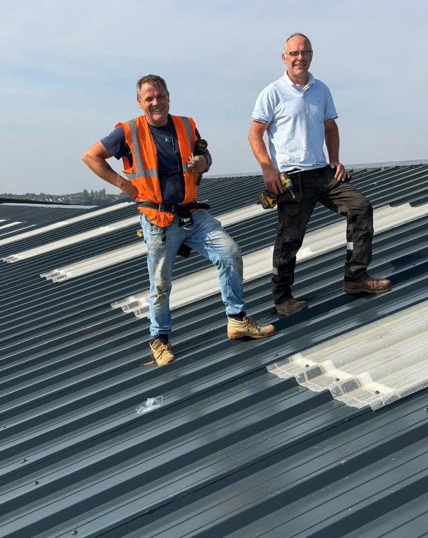 The team on a completed roof